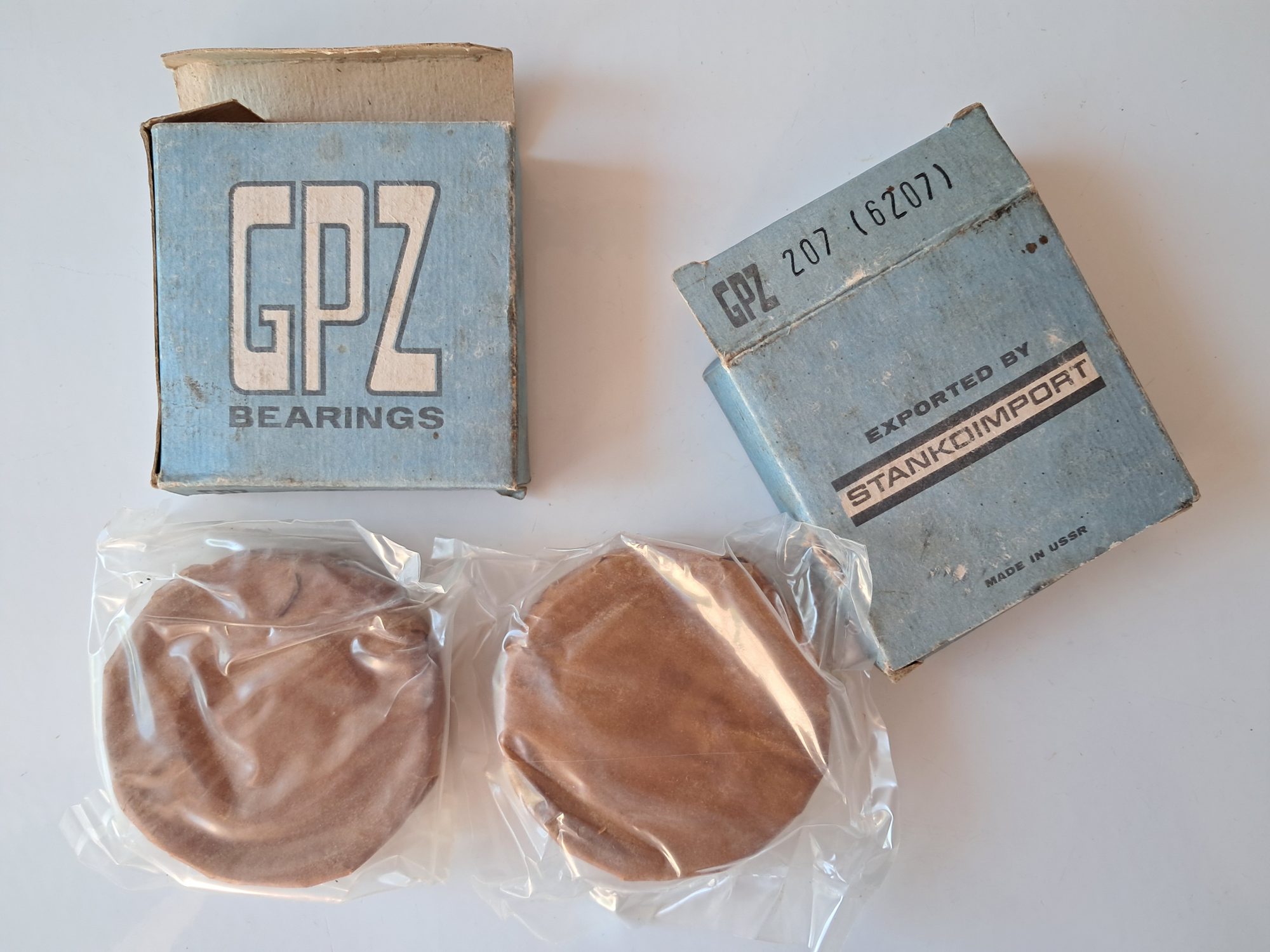 A single-row ball bearing still sealed in its original box and wrapping